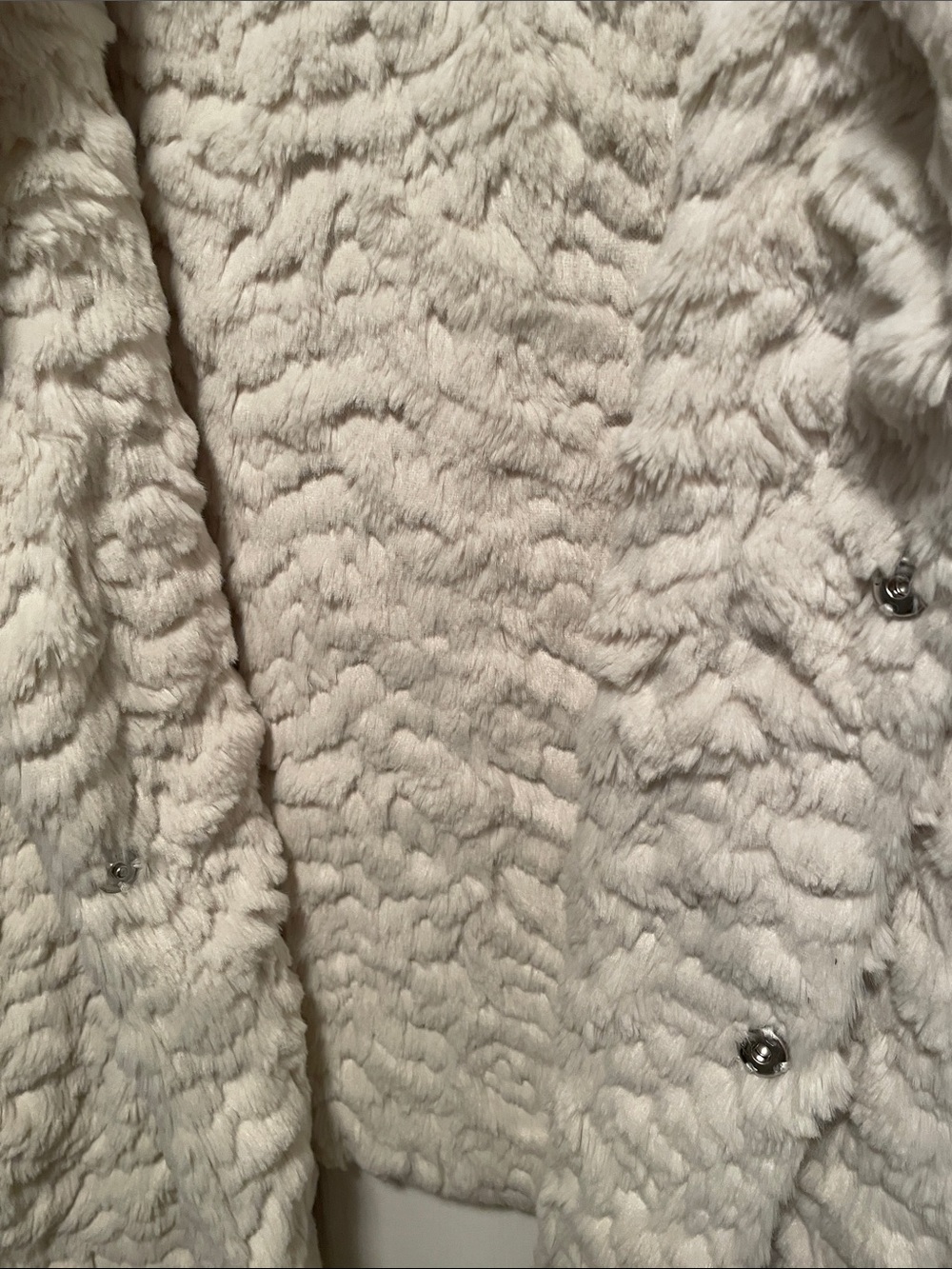 Size L women’s cream color fur west by Dylan pockets and two snap closures